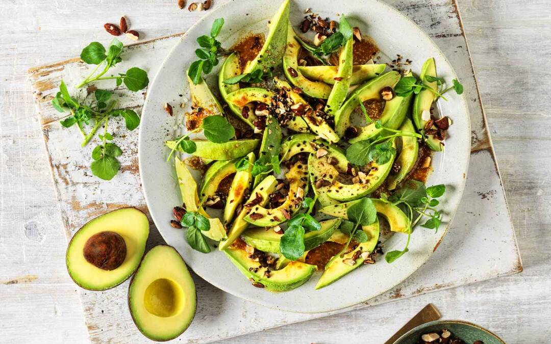 Avocado salad with miso-ginger dressing and savoury granola