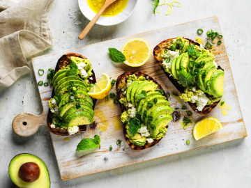 Crushed avocado on grilled sourdough with mint and ricotta